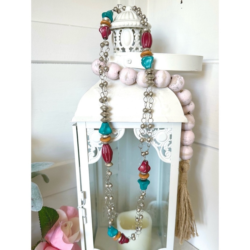 Pretty beaded necklace with red & blue & silver beads.